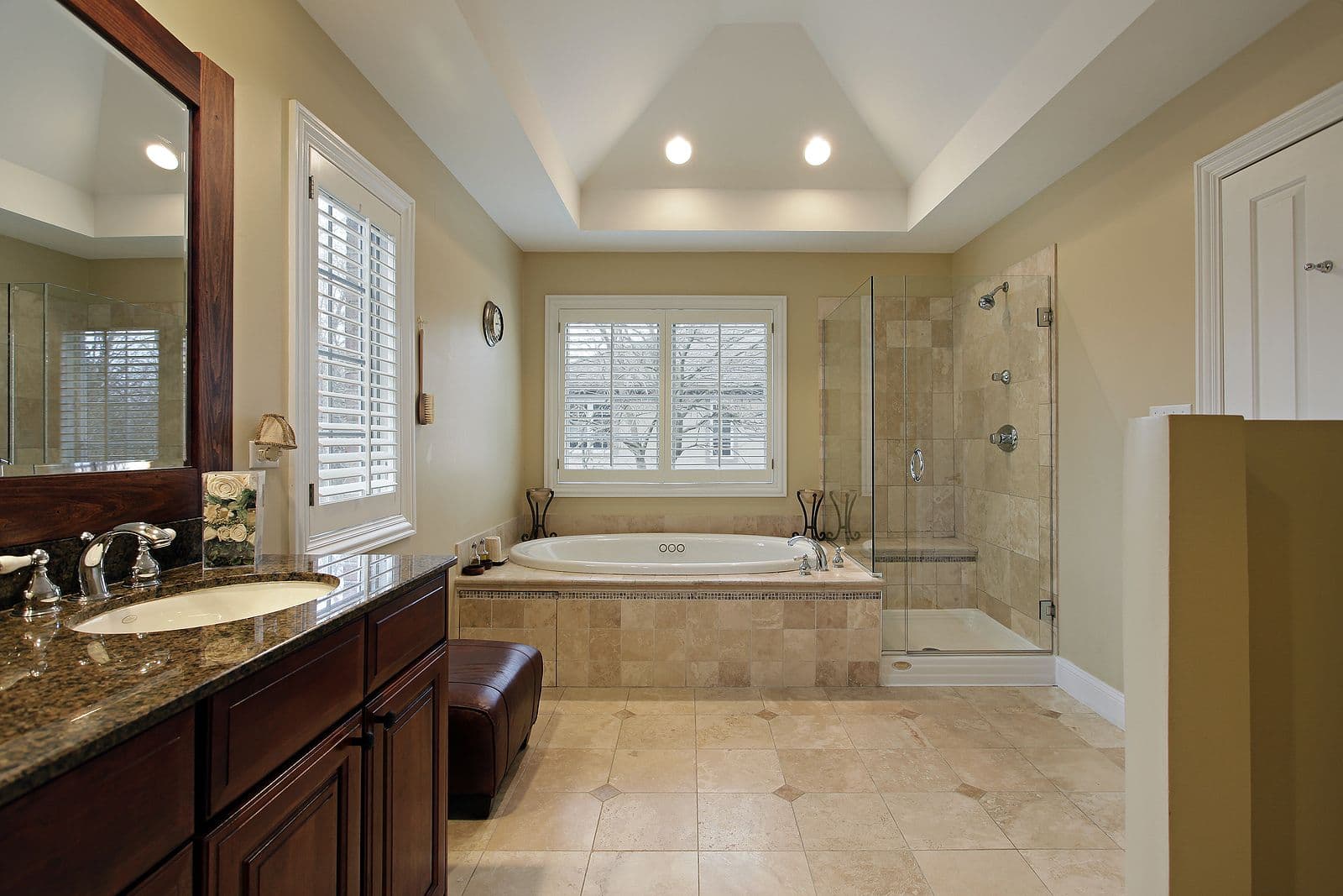 Master bathroom with glass shower and tub.